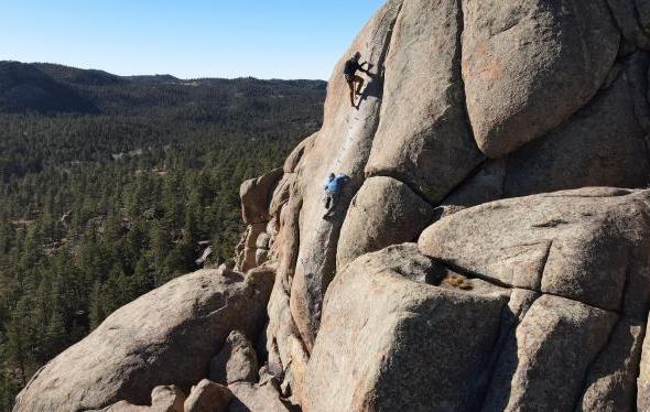 group climbing over kmc landscape